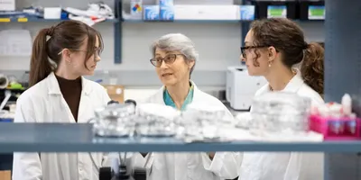 Researchers discussing consumer product testing in a lab