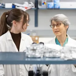 Researchers discussing consumer product testing in a lab