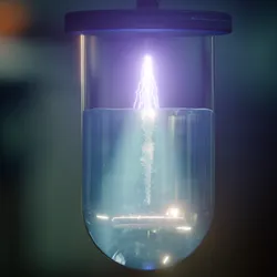 Experimental setup showing cold atmospheric plasma treatment in water
