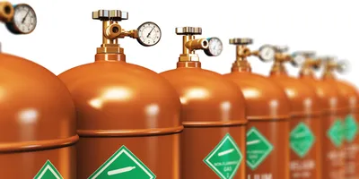 Row of filled helium tanks for laboratory use