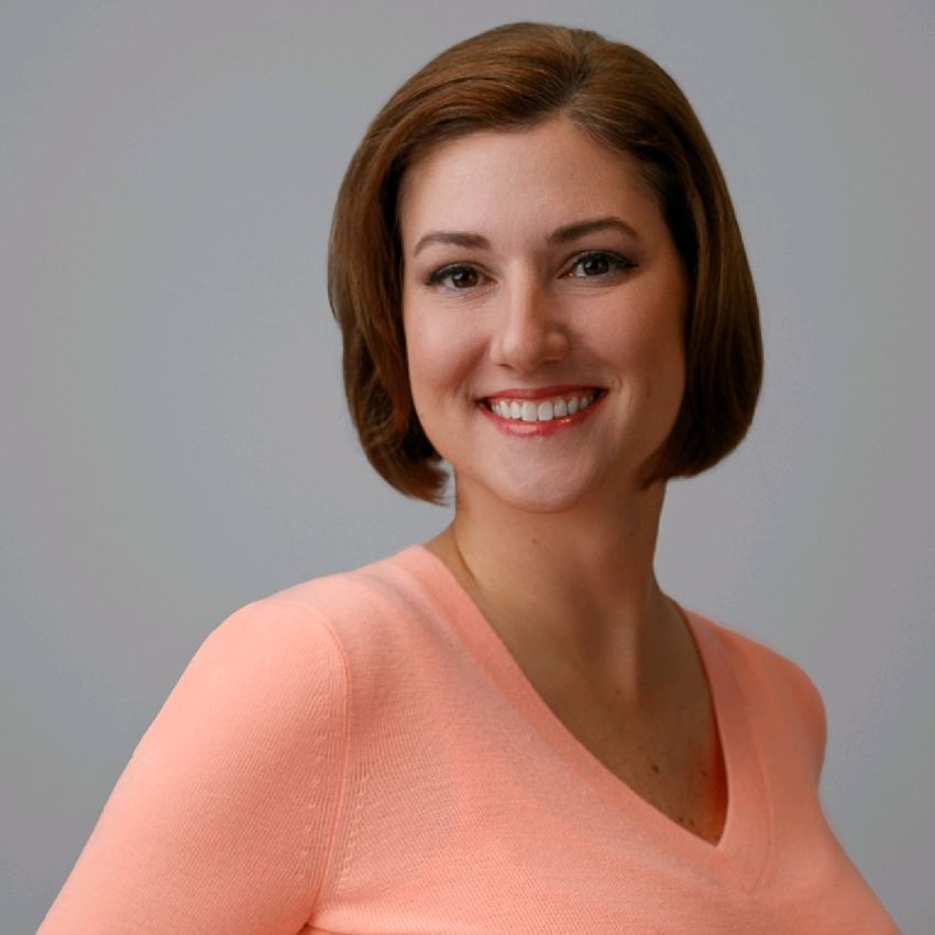 Headshot of a woman with brown hair