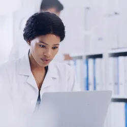 Lab manager working with a LIMS in the lab.