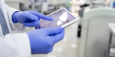 Laboratory worker accessing data integrity records