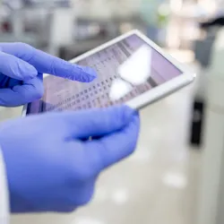 Laboratory worker accessing data integrity records
