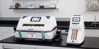 Epredia SlideTracker and BlockTracker automated pathology specimen tracking systems on a lab bench, with slide and cassette input trays loaded.