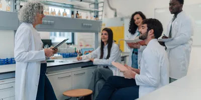 Group of lab staff and manager hosting post-occupancy evaluation in the lab.