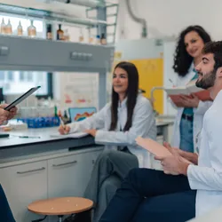 Group of lab staff and manager hosting post-occupancy evaluation in the lab.