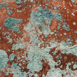 Oxidized copper surface showing green and blue corrosion patterns