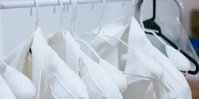 Clean lab coats symbolizing sporicidal laundry validation