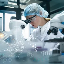 Scientist uses microscope in a laboratory, focusing on AI security in research.