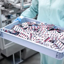Repackaged medicine samples being prepared for distribution