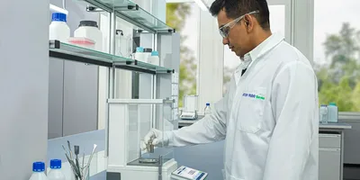 Image of lab worked using balance