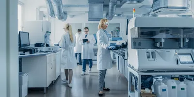 Researchers in a shared laboratory focused on safety protocols
