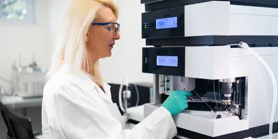 Researcher using equipment in a sustainable laboratory setting