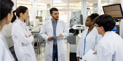 Lab staff holding a safety meeting.